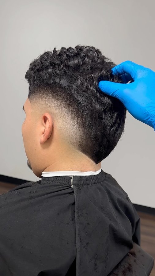 Instagram post by @j.marrtt for Barbershopconnect. Caption reads: [...] fade brought to you by @barbershopconnect....