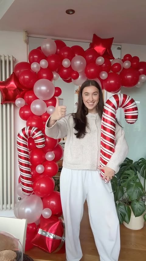 Instagram post by @kira_goode for B&M Stores. Caption reads: Finishing the £5 Novelty Christmas Balloon Arch....