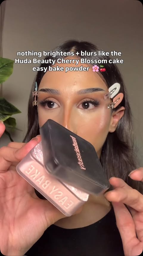 Instagram post by @danibedazzled for HUDA BEAUTY. Caption reads: the Huda Beauty Easy Bake powder in “Cherry [...].