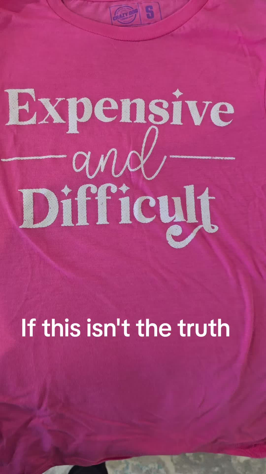 TikTok post by @wifeyrn for Crazy Dog TShirts. Caption reads: @Crazy Dog Tshirts #expensiveanddifficult [...].