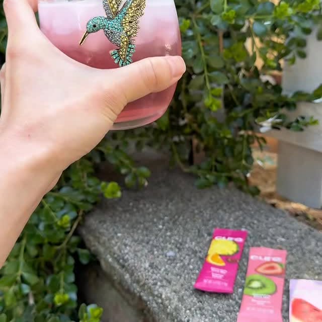 Instagram post by @berlinburgess for Cure Hydration. Caption reads: [...] ❤️ @cure #stayhydrated #electrolytes....