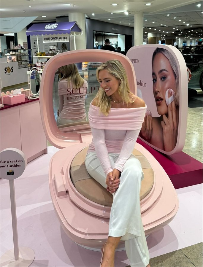 Instagram post by @aimeeconnolly_com for Sculpted By Aimee. Caption reads: This is really cream cushion’s world and we’re all....