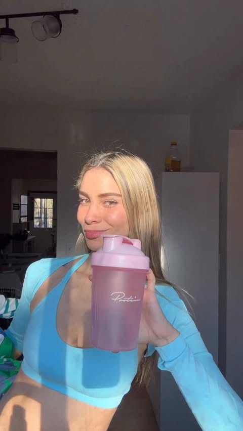 Instagram post by @domenicaavalverde for Protein.com. Caption reads: Not just a protein… a mom essential 🤍🏋🏼‍♀️....