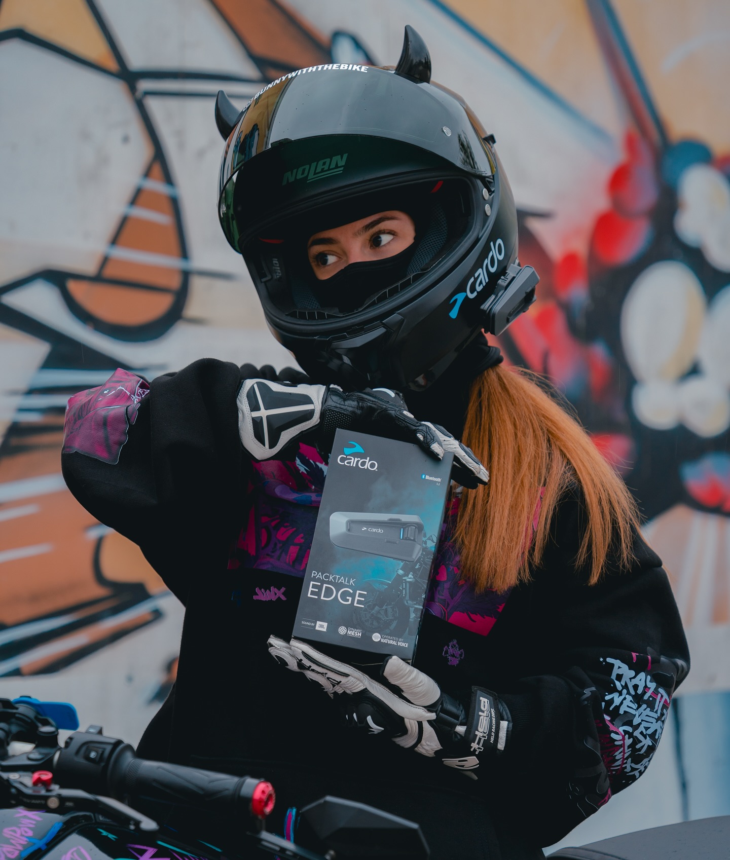 Instagram post by @bunnywiththebike for Cardo Systems. Caption reads: ✨𝗜𝗧‘𝗦 𝗚𝗜𝗩𝗘𝗔𝗪𝗔𝗬 𝗧𝗜𝗠𝗘✨ 

Ich habe die....
