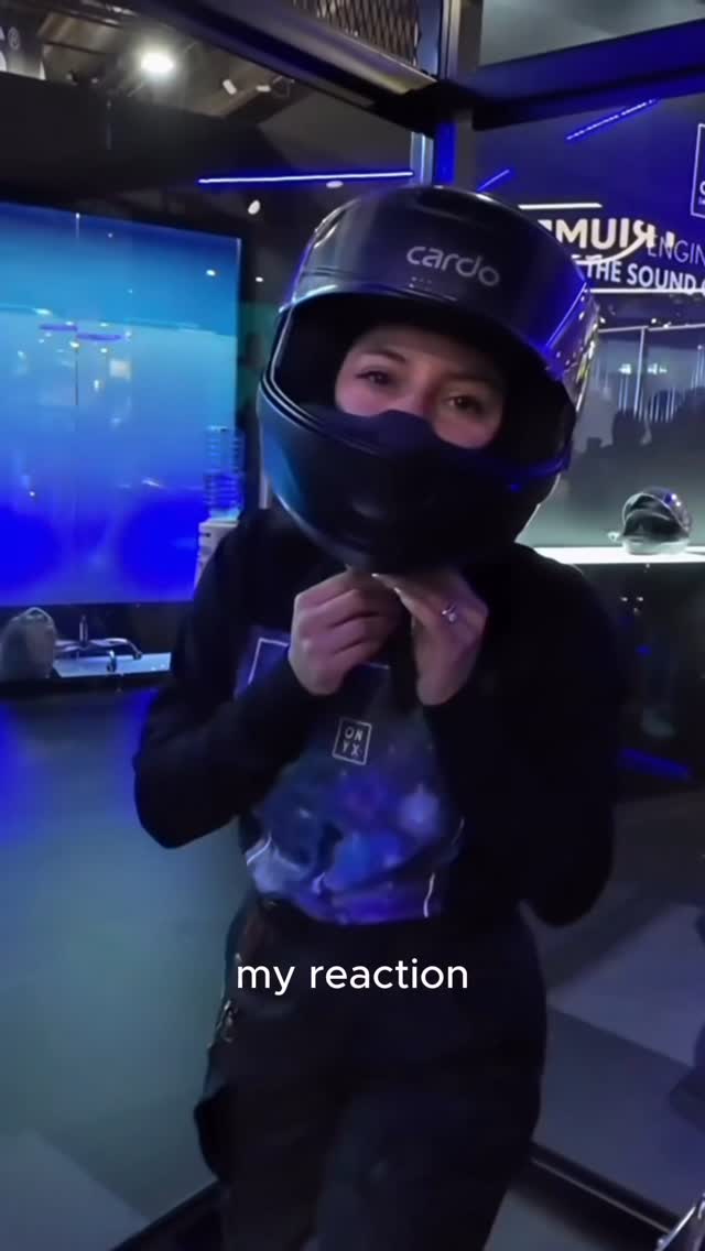 Instagram post by @thatmotogal for Cardo Systems. Caption reads: No more wires, no more add-ons. Cardo’s BEYOND GTS....