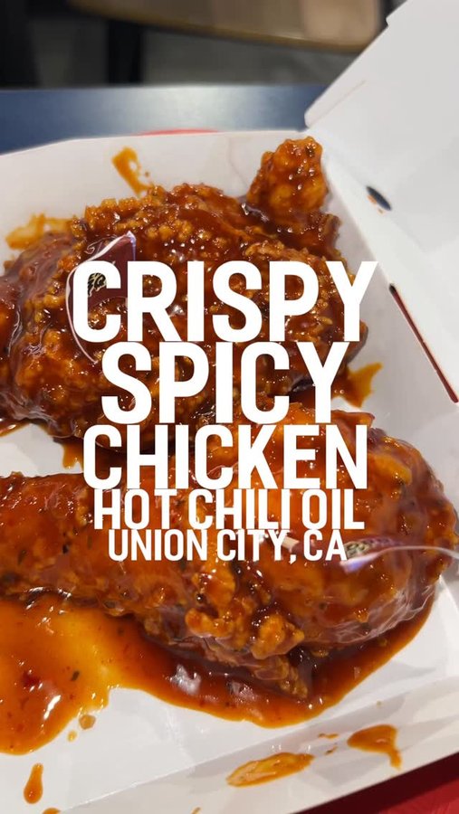 Instagram post by @grubwitmike for Jollibee US. Caption reads: CRISPY SPICY CHICKEN WITH HOT CHILI OIL IN UNION....