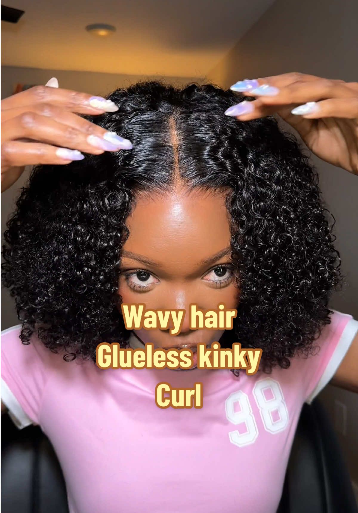 TikTok post by @mercirella1 for Wavymy Hair. Caption reads: Glueless 16inch Afro curly wig 7x5 closure .link....