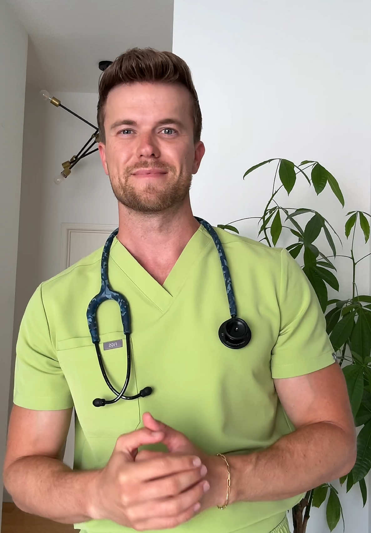 TikTok post by @jakegrez for FIGS. Caption reads: [...] 🍵 and magenta scrubs- out now!! @wearfigs....