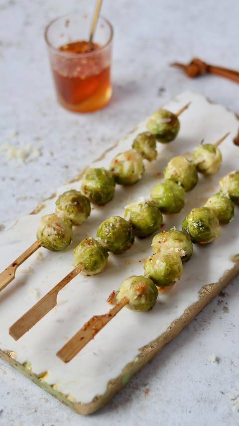 Instagram post by @alexarciab for Degusta Box. Caption reads: HOT HONEY ROASTED BRUSSELS SPROUTS 

✅ Easy to....