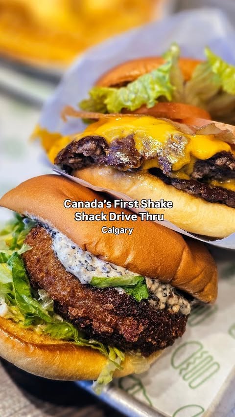Instagram post by @drinks.withus for Shake Shack. Caption reads: Calgary, get ready 🍔👀 Shake Shack is opening....