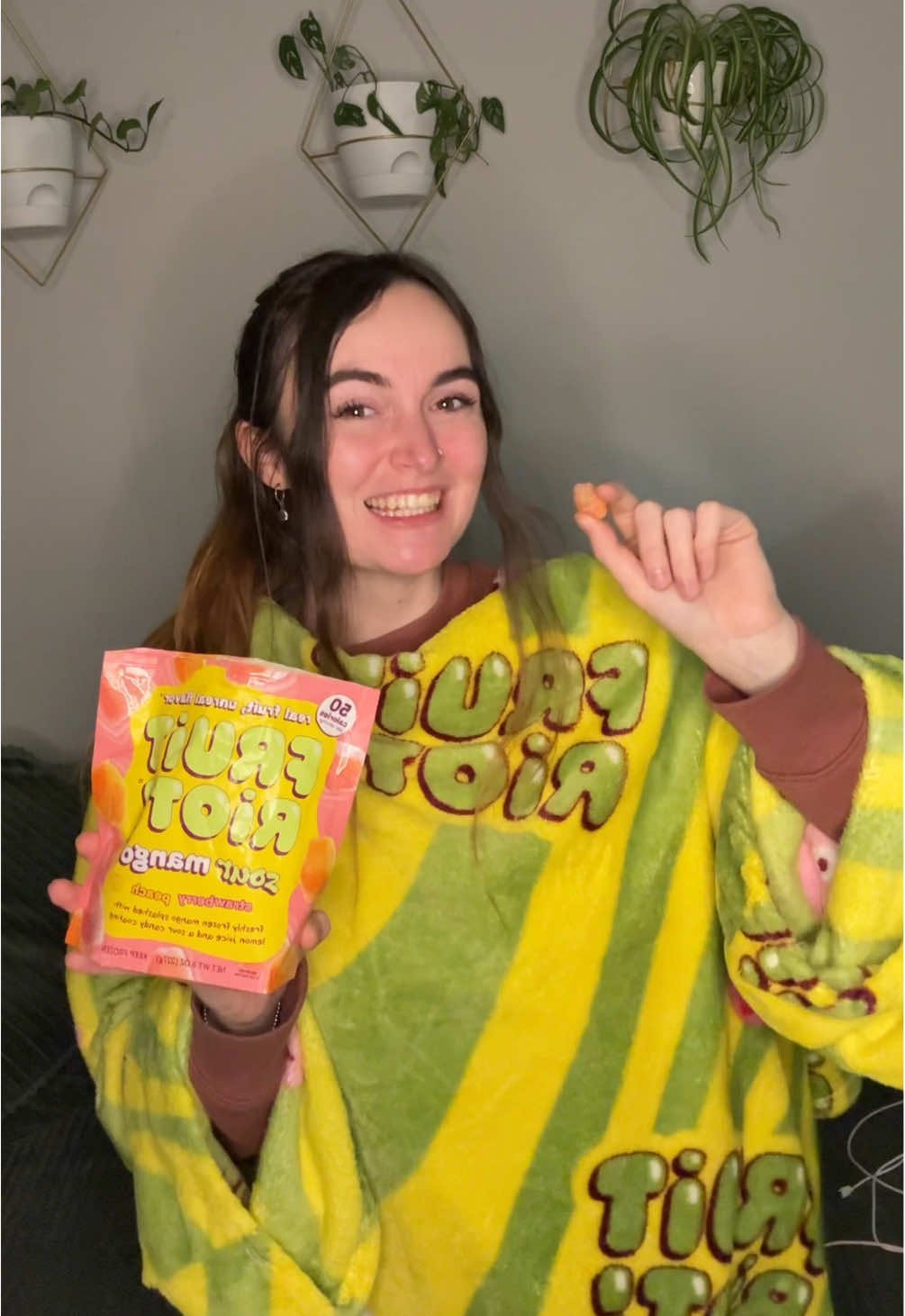 TikTok post by @alytheslp for Snuggie. Caption reads: [...] snack with @fruit riot 💚 I grabbed my....