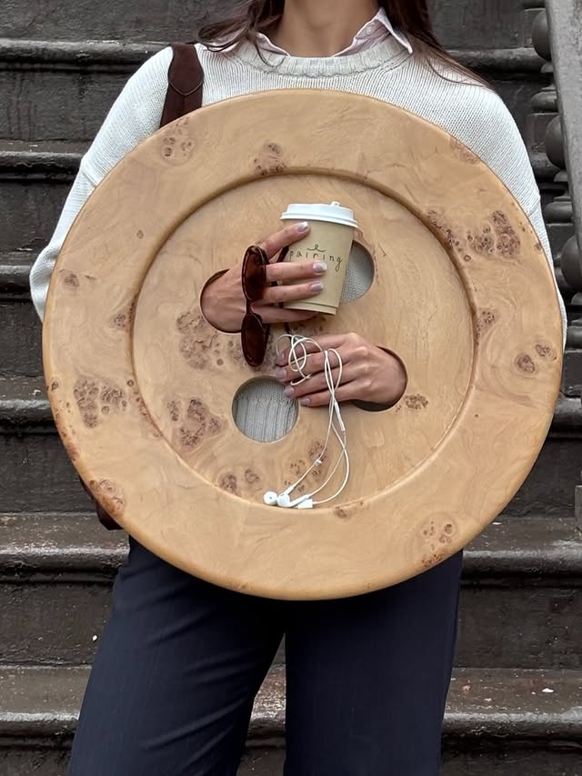 Instagram post by @girlscarryingshit for West Elm. Caption reads: [...] shit from the @emmachamberlain x @westelm....