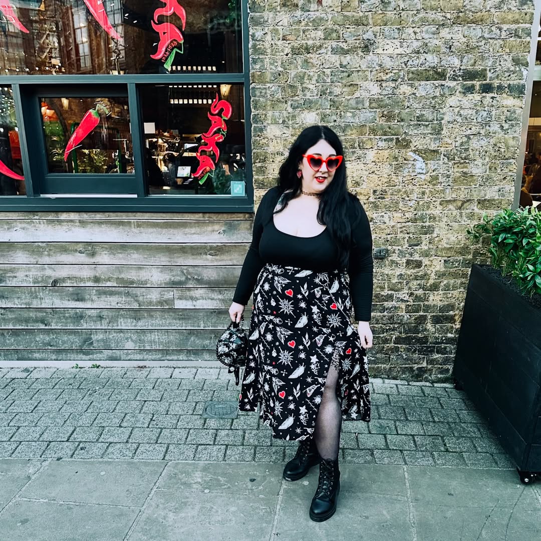 Instagram post by @thick.thighs_and_green.eyes for Hell Bunny. Caption reads: [...] holiday weekend in the Leah skirt by....