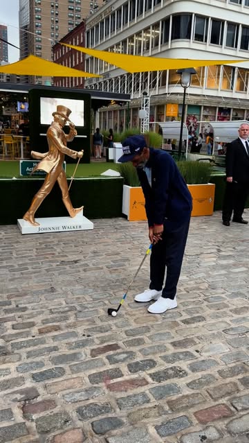 Instagram post by @thepeoplegallery_ for Johnnie Walker. Caption reads: Tiger Hood NYC for
@johnniewalkerus #AD
Sip....