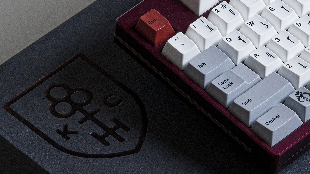 YouTube post by @alexotos for Unikeyboards. Caption reads: Keycult x NovelKeys? (and it will be in stock).