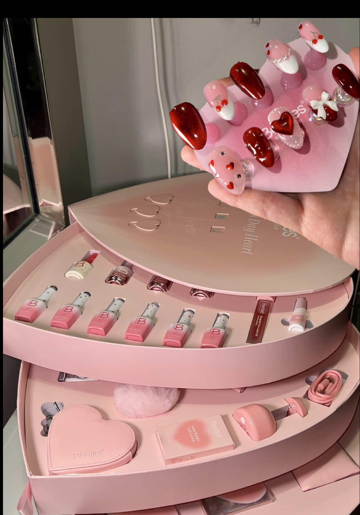 TikTok post by @real.natalia for BeetlesGelPolish. Caption reads: This Forever In Love Box is actually so cute. It....