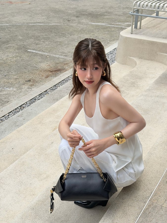 Instagram post by @fayefayeye for FERRAGAMO. Caption reads: Gimme a hug 🤍

@FERRAGAMO #FerragamoFW25....