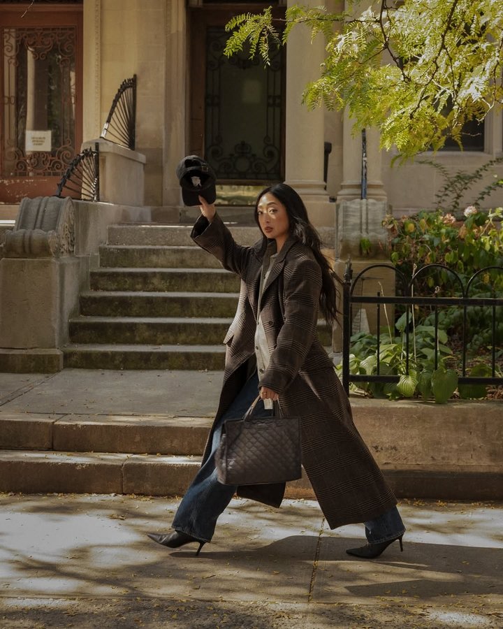 Instagram post by @theserenagoh for MZ Wallace. Caption reads: everyday brings its own rhythm, and what we carry....