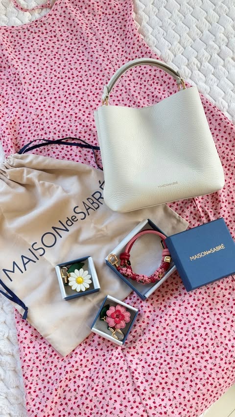 Instagram post by @karesdiaryx for MAISON de SABRÉ. Caption reads: [...] over how cute these bag charms from....
