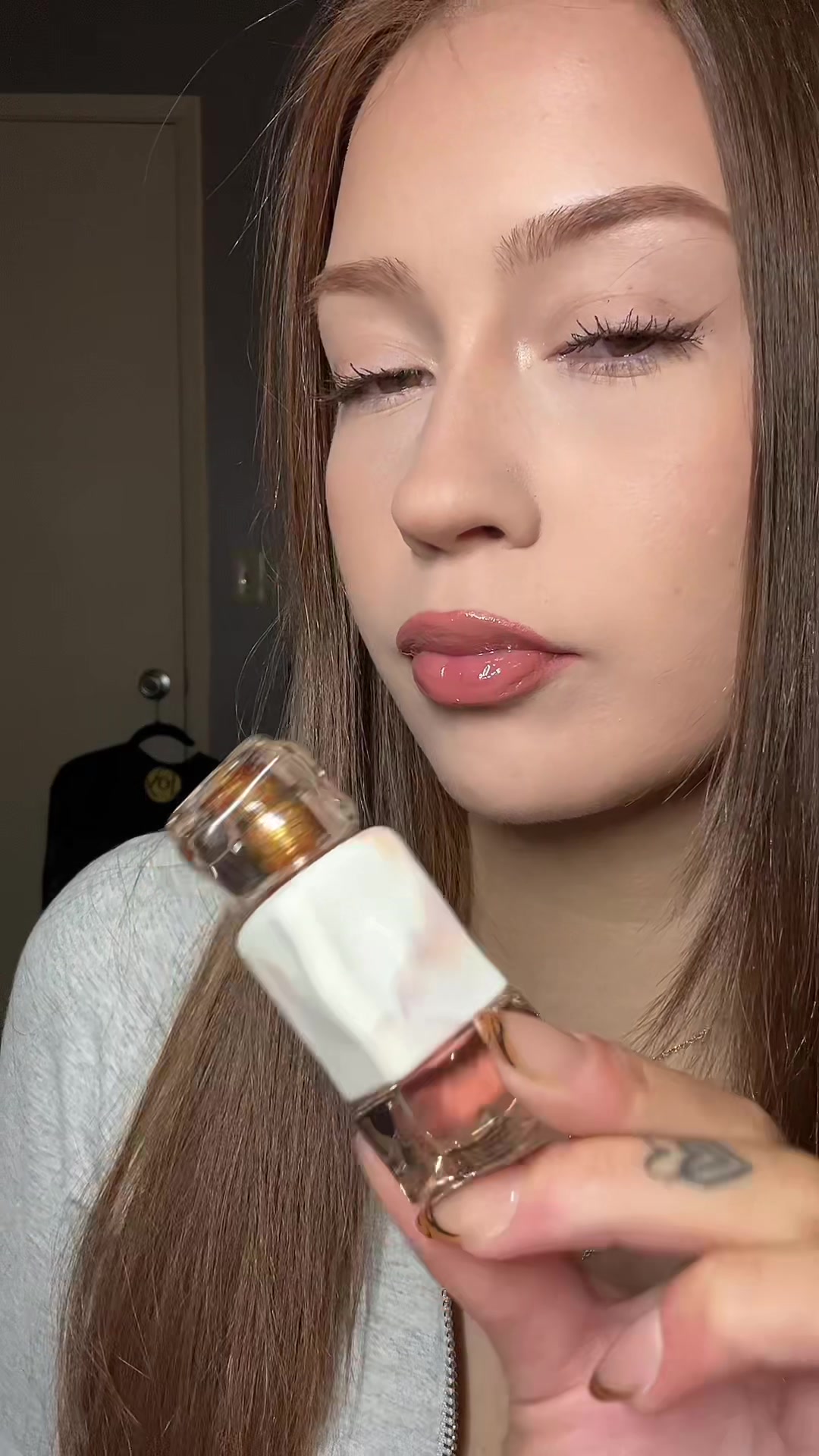 TikTok post by @lizzie.mcclainn for Mistine. Caption reads: @mistine.us Thai Latte lip glaze 💋 [...].