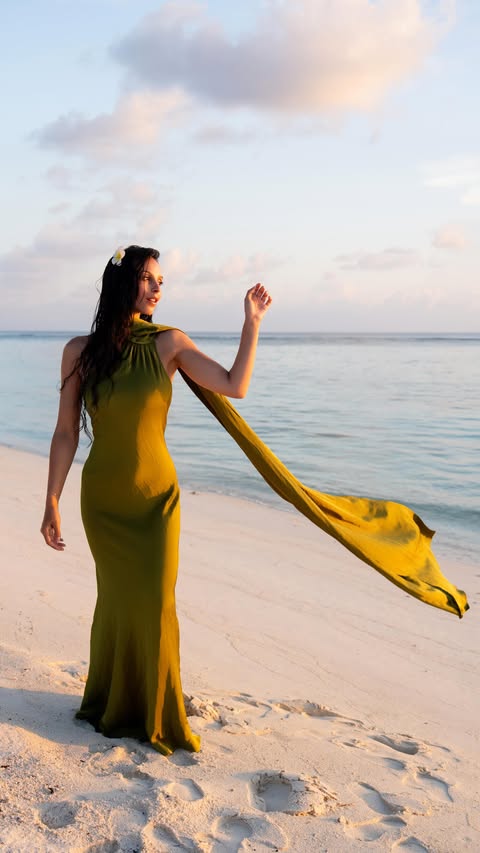 Instagram post by @danamouyon for Radisson. Caption reads: Perfect sunset dress 💚 📍....