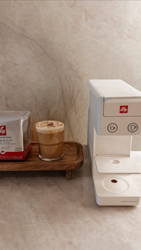 Instagram post by @groundedinneutral for illy. Caption reads: [...] cup of coffee on a slow morning ☕️🥐....