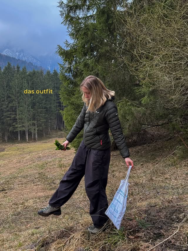 Instagram post by @emmistrasser for SALEWA. Caption reads: [...] side quest 🌱💌 *ad: jacke & schuhe von....