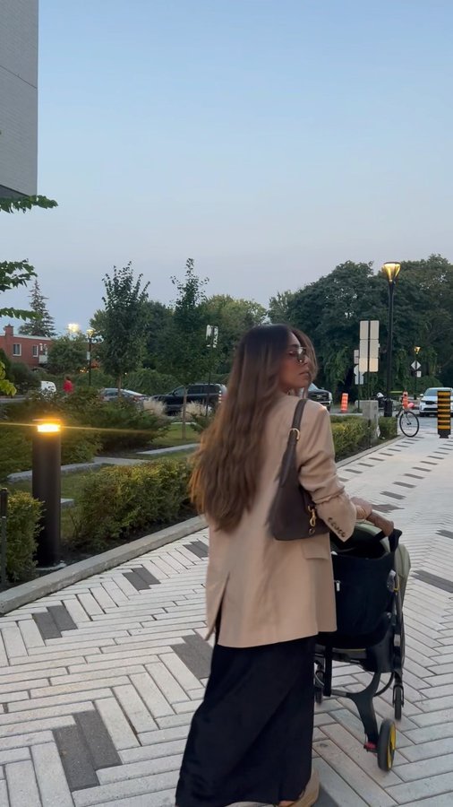 Instagram post by @modestfashionbydebs for Doona. Caption reads: Strolling in style with my doona! Elevating every....