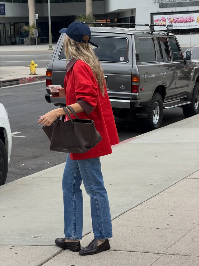 Instagram post by @angelafink for Varley. Caption reads: Never too much red. @varley #ad.