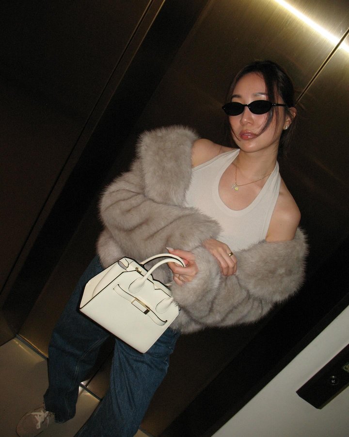 Instagram post by @wangmelinda for Valextra. Caption reads: Morning and evening, two different vibes with....