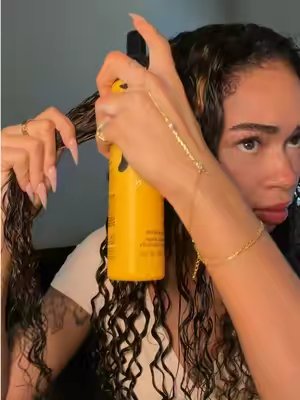 TikTok post by @thekaylaflash for OQ Hair Shop. Caption reads: Curl defining is key! 🤎 @OQHAIR @oqhairshop ✨....