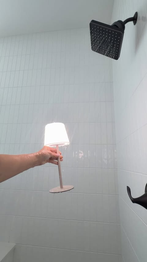 Instagram post by @my.blessed.home for EZVALO. Caption reads: [...] lamp makes your shower feel like a spa....