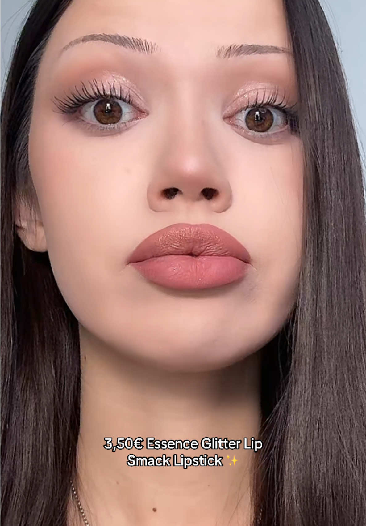 TikTok post by @valeria_deldinova for Essence Cosmetics. Caption reads: New Essence - Nuts About You Glitter Switch Liquid....