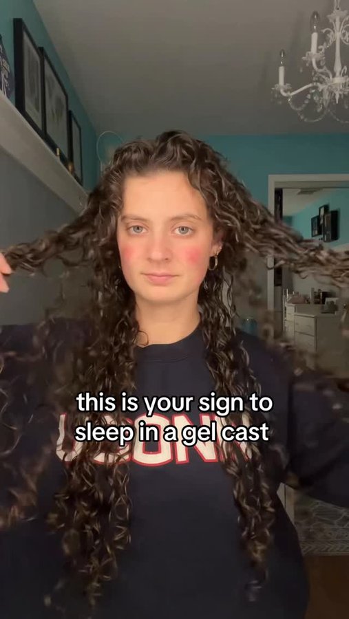 Instagram post by @julesdell_ for K18 Hair. Caption reads: I love doing this with my curly hair #curls....