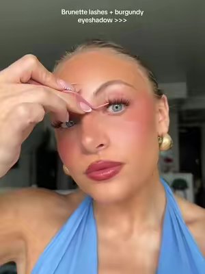 TikTok post by @alyssa_bogdan for FlutterHabit. Caption reads: Lashes from @flutterhabit ofc and eyeshadow....