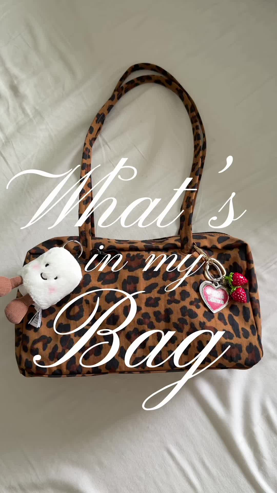 TikTok post by @_hellaella_ for BAGGU. Caption reads: what’s in my bag ft my new @BAGGU 😋 I’m so....