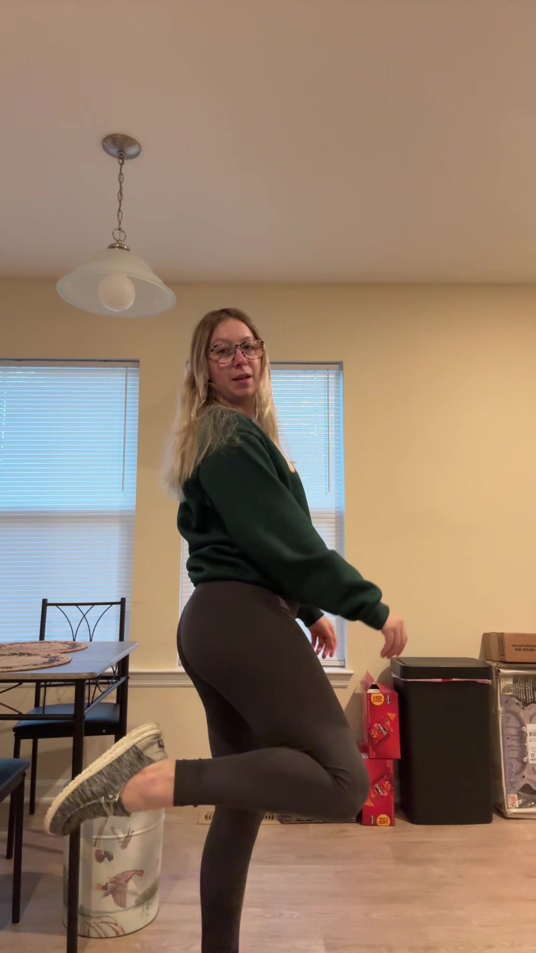 TikTok post by @baileyannbrumit for HEYDUDE shoes. Caption reads: Shirt: @TikTok Shop 🇺🇸  Leggings: @aerie  Shoes:....