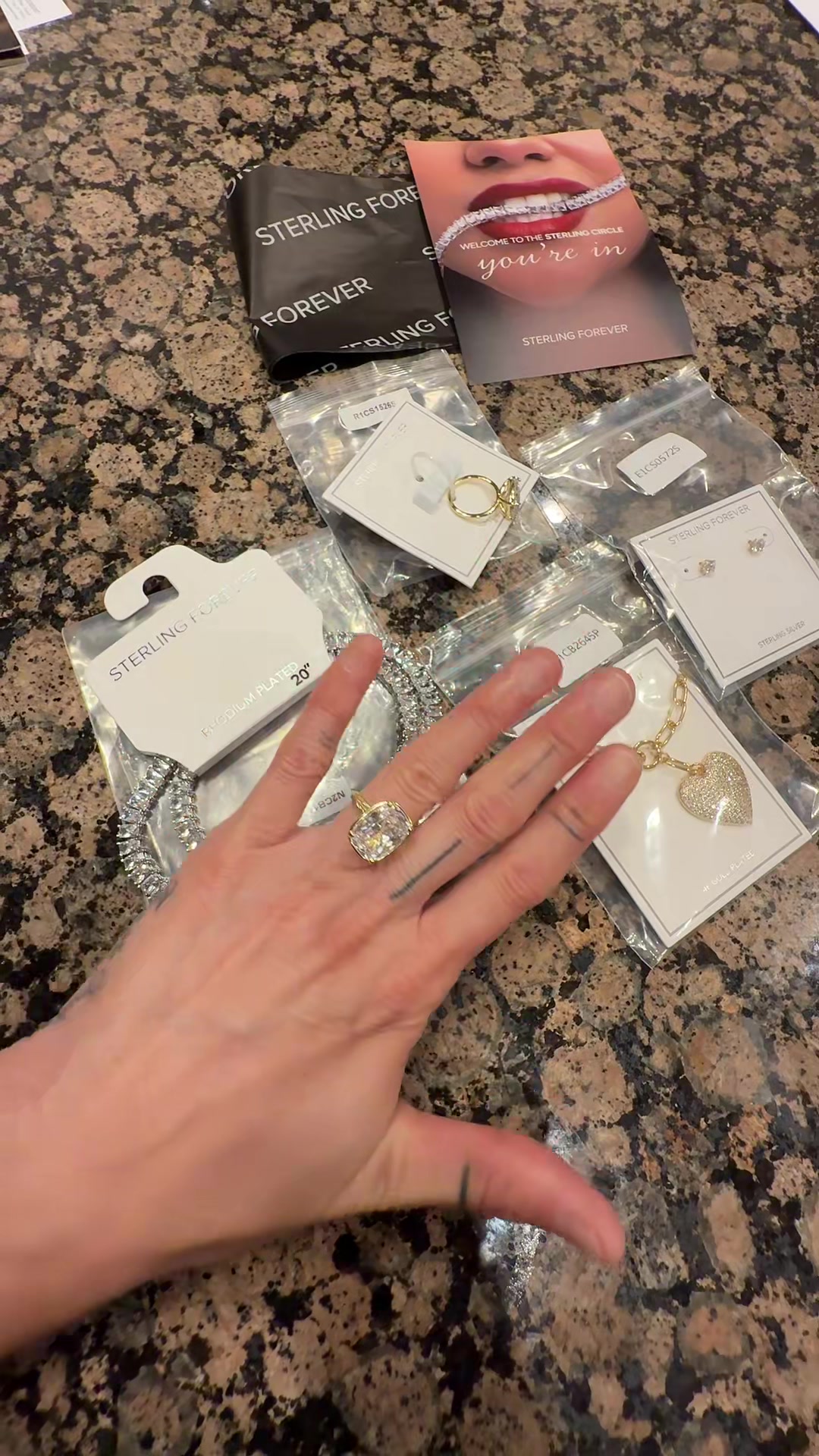 TikTok post by @nataliejg for Sterling Forever. Caption reads: Just opened a jewelry delivery from Sterling....