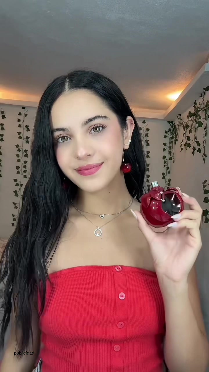 TikTok post by @cass_iturralde_ for NINA RICCI. Caption reads: @Nina Ricci 💗 #NinaRicci #NinaRougeCrush....