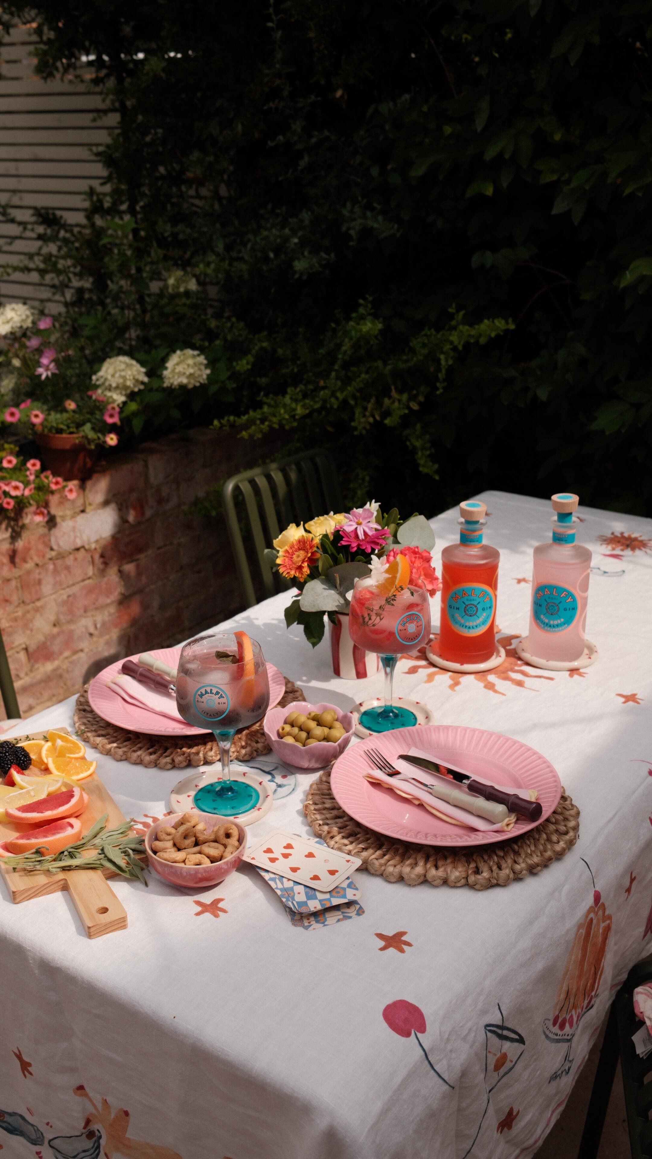 Instagram post by @claireakennedy for MALFY Gin. Caption reads: Ad making the most of alfresco dining moments with....