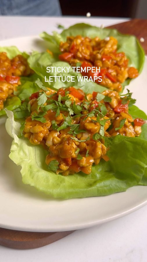 Instagram post by @avocado_skillet for LightLife. Caption reads: These sticky tempeh lettuce wraps are so good. I....