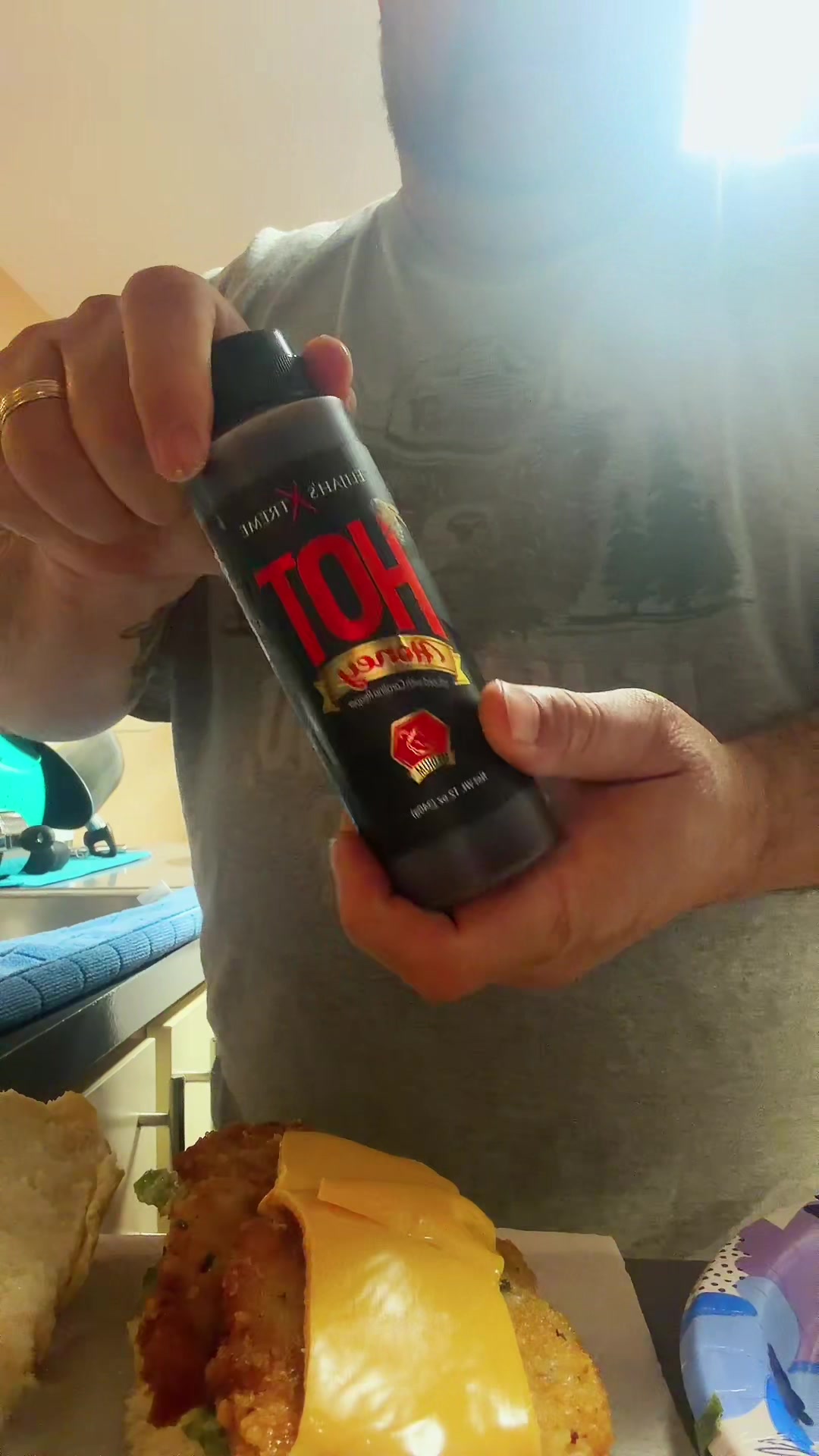 TikTok post by @gangsta_gramps for Elijah's Xtreme. Caption reads: @Elijah’s Xtreme Hot Sauce #tiktokshop....