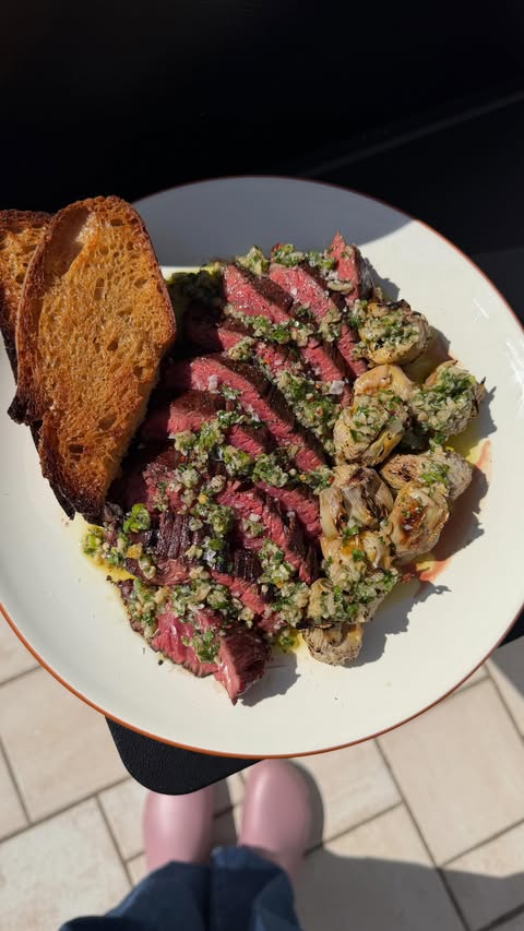 Instagram post by @haileecatalano for Traeger Grills. Caption reads: [...] chimichurri and the new Westwood....