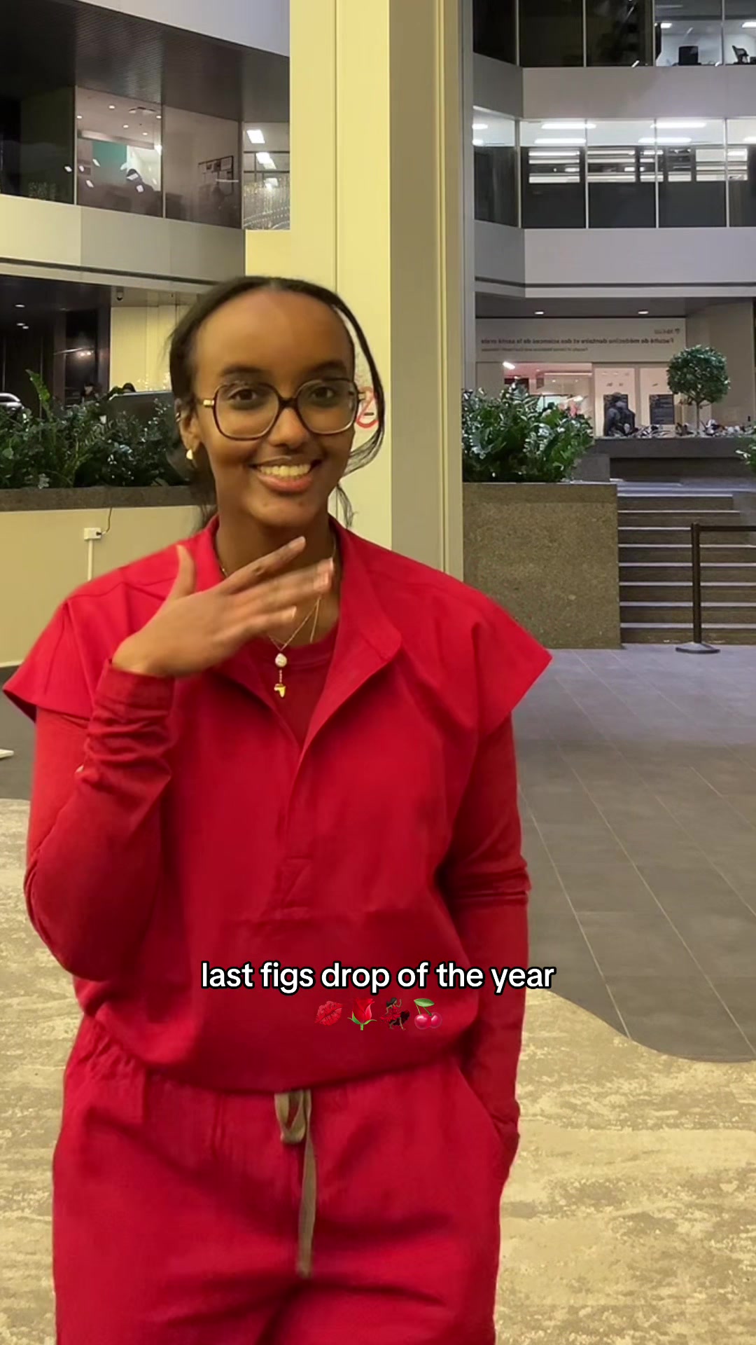 TikTok post by @mdphdchronicles for FIGS. Caption reads: [...] sooo flattering 💋🌹💃🏾🍒 #scrubs #wearfigs....