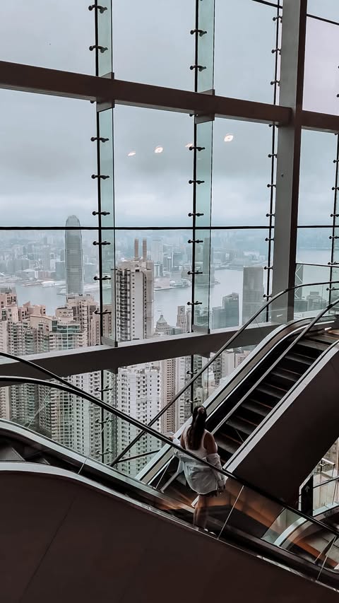Instagram post by @passportandstamps for Discover Hong Kong. Caption reads: [...] view in Hong Kong 🥹🇭🇰 /ad....
