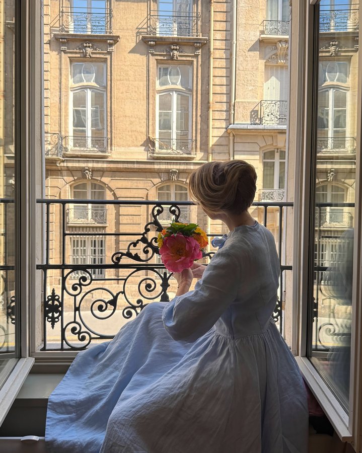 Instagram post by @solene.gisele for VANESSA BRUNO. Caption reads: Elegant bun, romantic dress, and flowers… ready to....