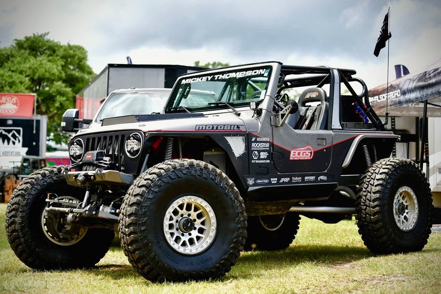 Instagram post by @recoil_tj for Motobilt. Caption reads: All packed up and headed home from @jeepinthecoast....