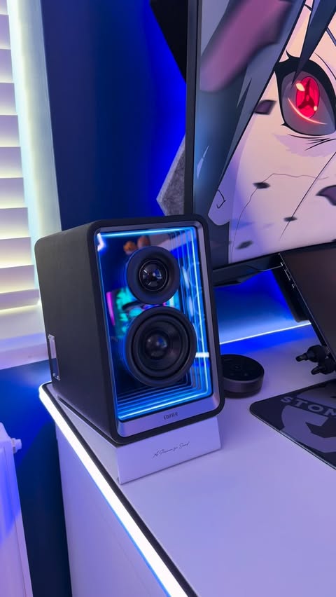 Instagram post by @stommagames for PlayStation. Caption reads: These are the Edifier QR65 speakers, my desk feels....