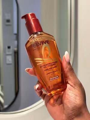 TikTok post by @mellicer for L'Oréal Paris South Africa. Caption reads: My curls are my crown, so I’m all about giving....