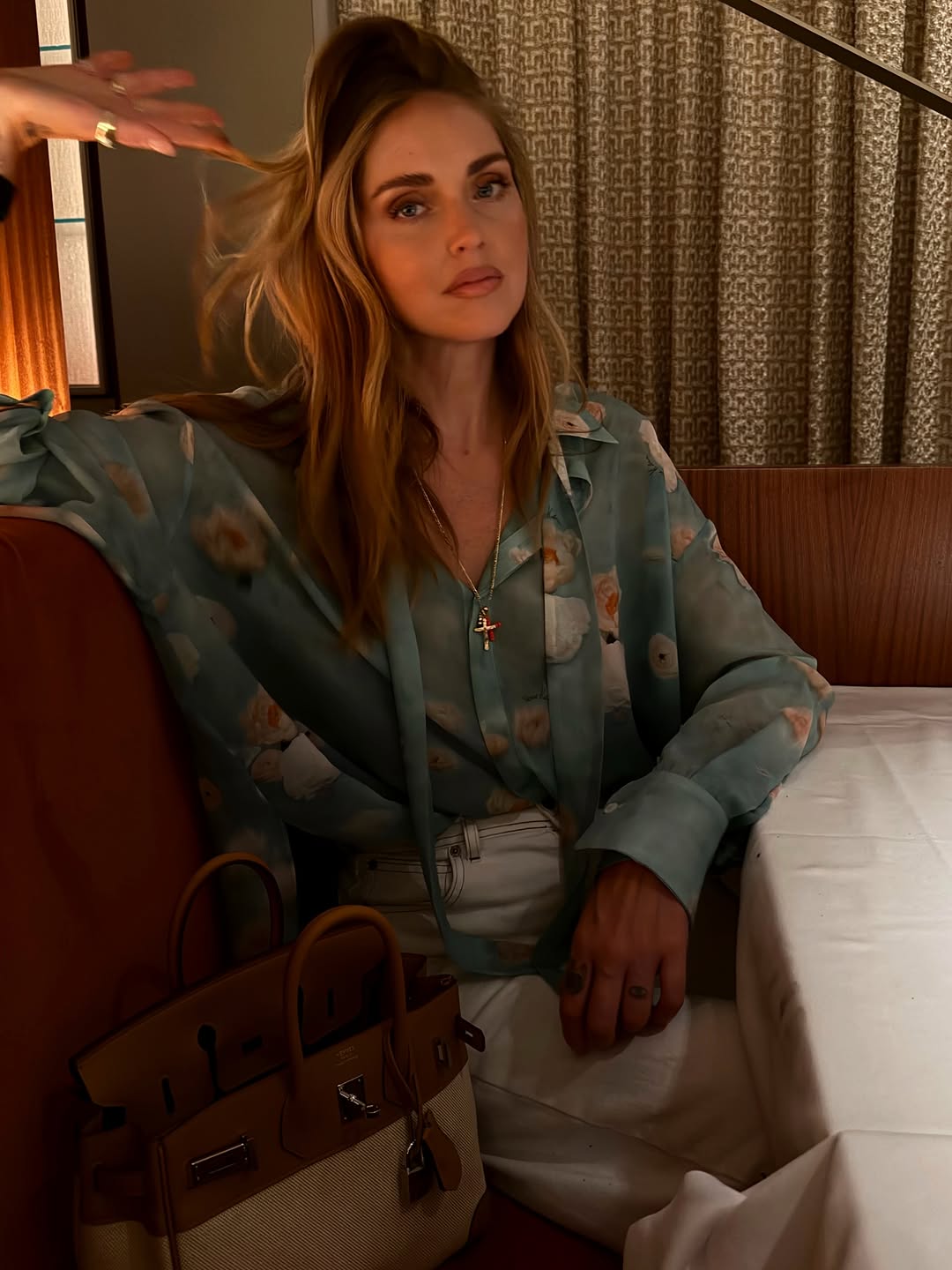 Instagram post by @chiaraferragni for GUESS. Caption reads: [...] for campaign day Terrace nights Bag by....